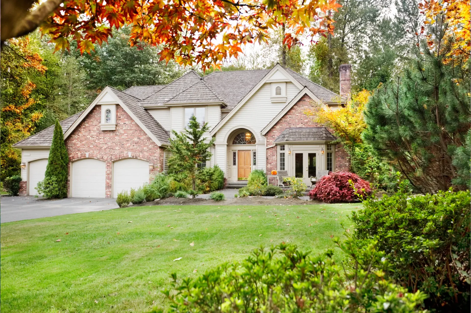 A large house with trees in the background